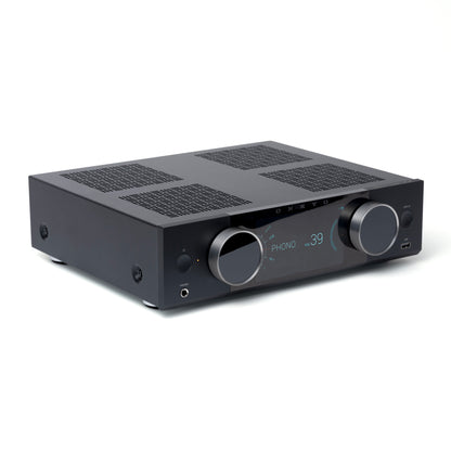 Black audio amplifier with control knobs on a white background