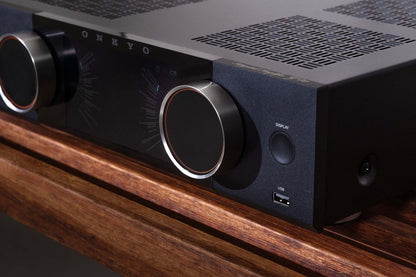 Onkyo audio amplifier on a wooden surface