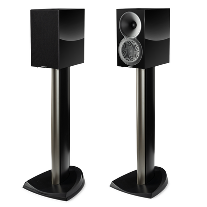 Pair of black bookshelf speakers on floor-stands on white background