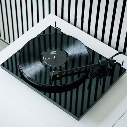 Lifestyle view of Pro-Ject E1 Turntable with Pick It MM E Cartridge in gloss black