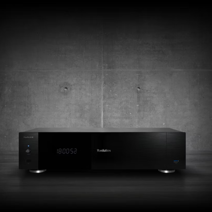 Black electronic device with digital display on a dark concrete wall background