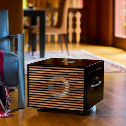 Black REL S/550 Subwoofer with wood grille in living room