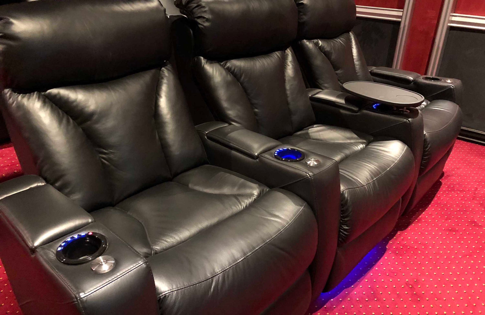 Refrigerated cup holders and tray tables included