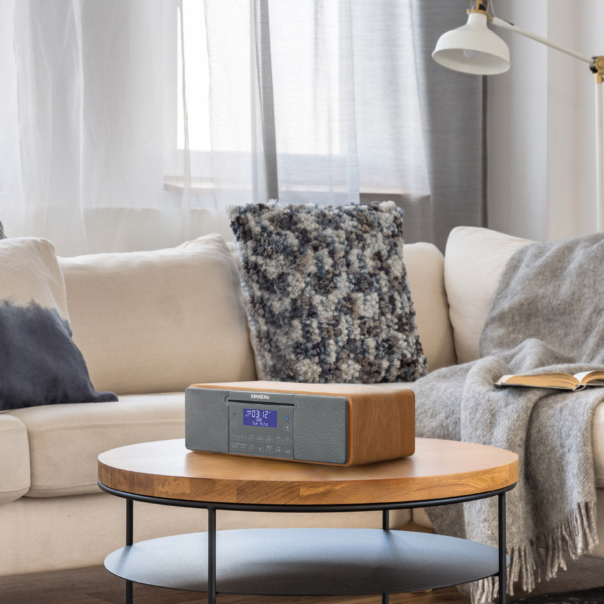 Wooden coffee table with a radio in a living room setting