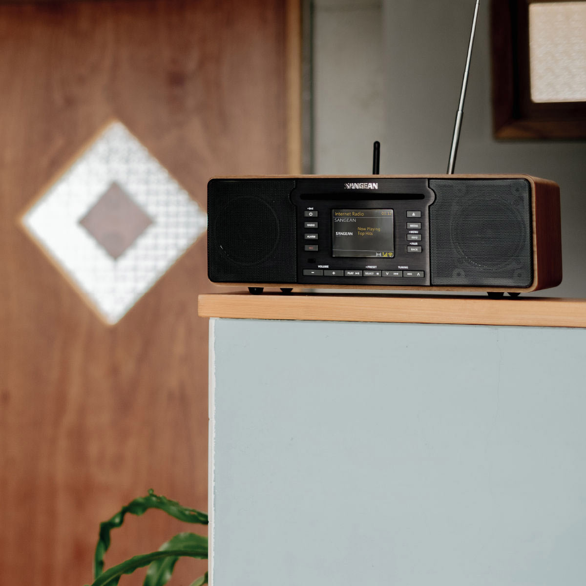 Radio receiver on a wooden surface with a blurred background