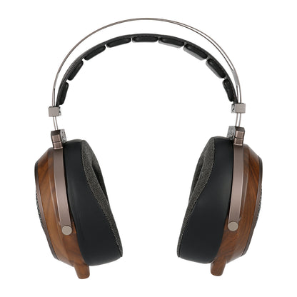 Wooden headphones with black ear pads on a white background