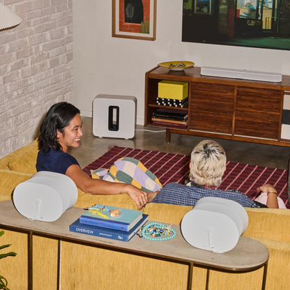 Living room with white Sonos products