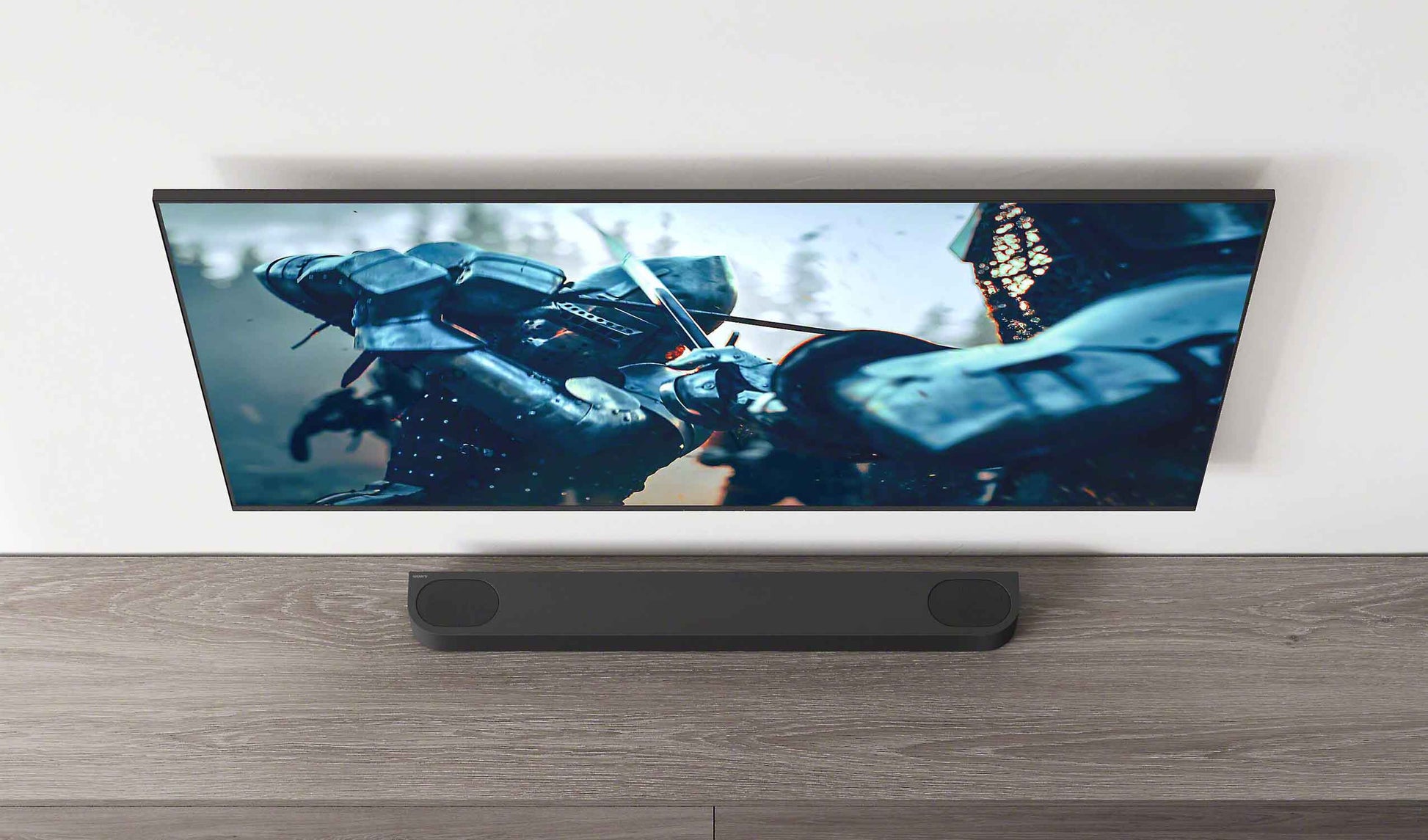Wide-screen TV displaying a motorcycle on a wooden stand