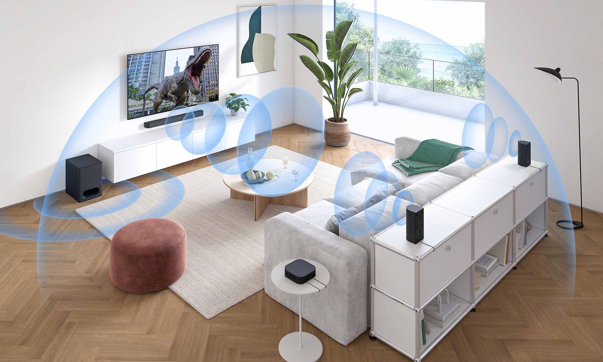 Living room setup with a TV, speakers, and a sofa.