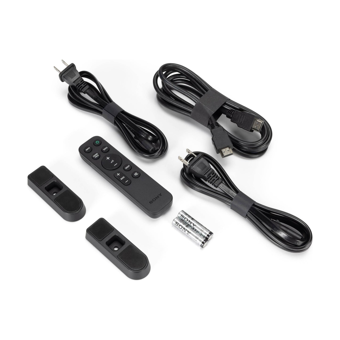 Collection of electronic accessories including cables and remote controls on a white background