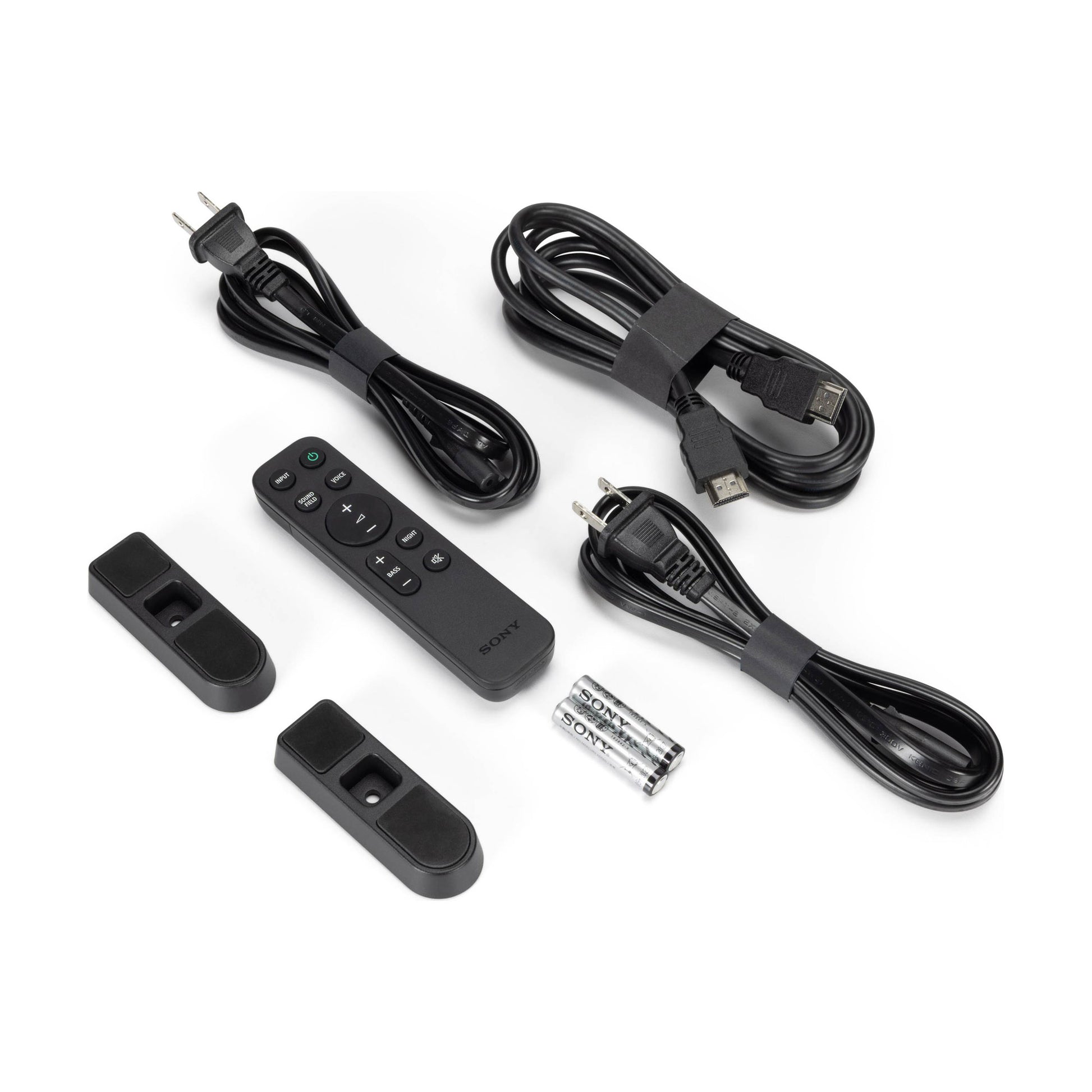Collection of electronic accessories including cables and remote controls on a white background