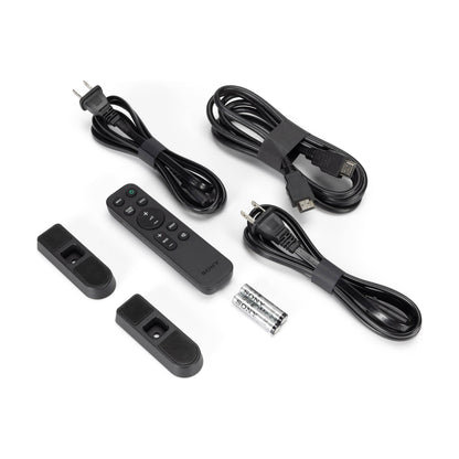 Collection of electronic accessories including cables and remote controls on a white background