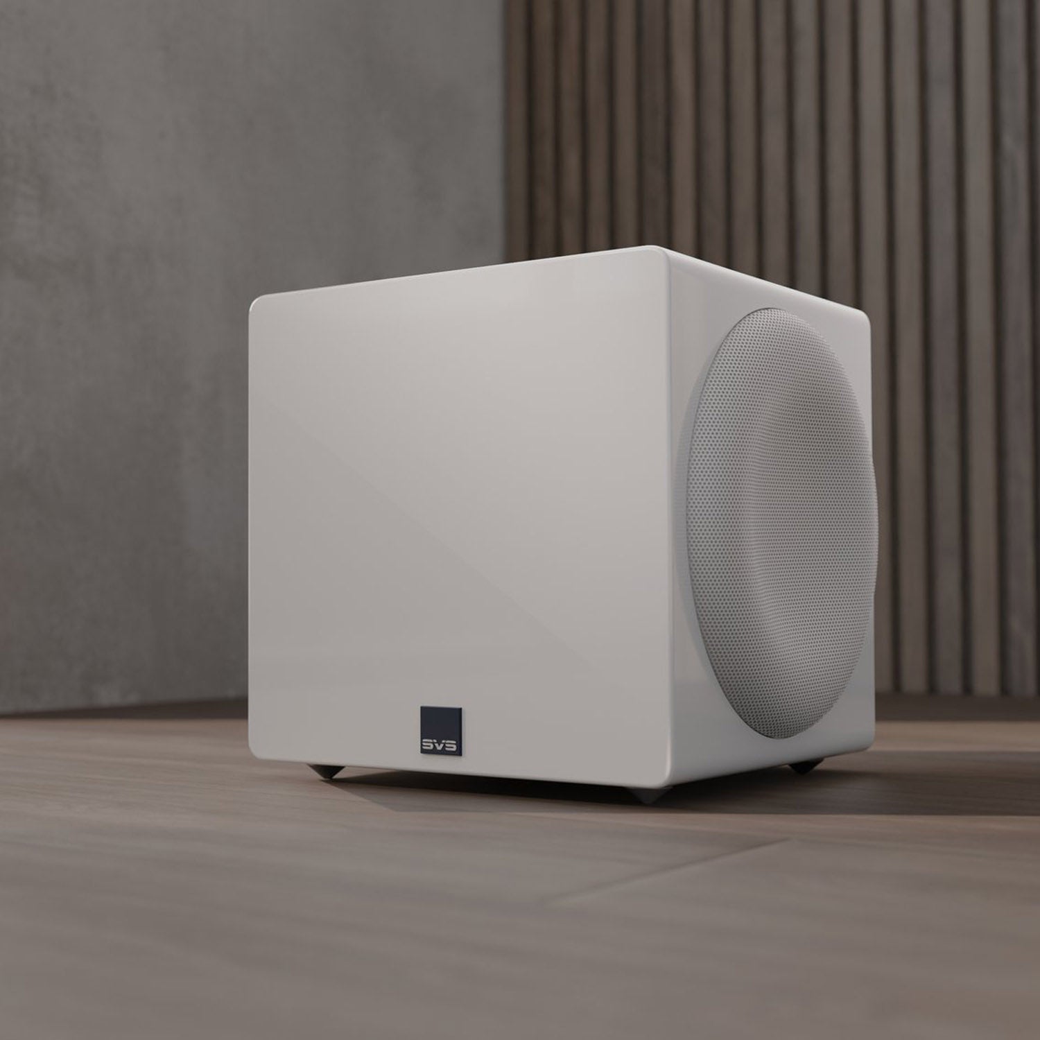 White subwoofer on a wooden floor with a neutral background