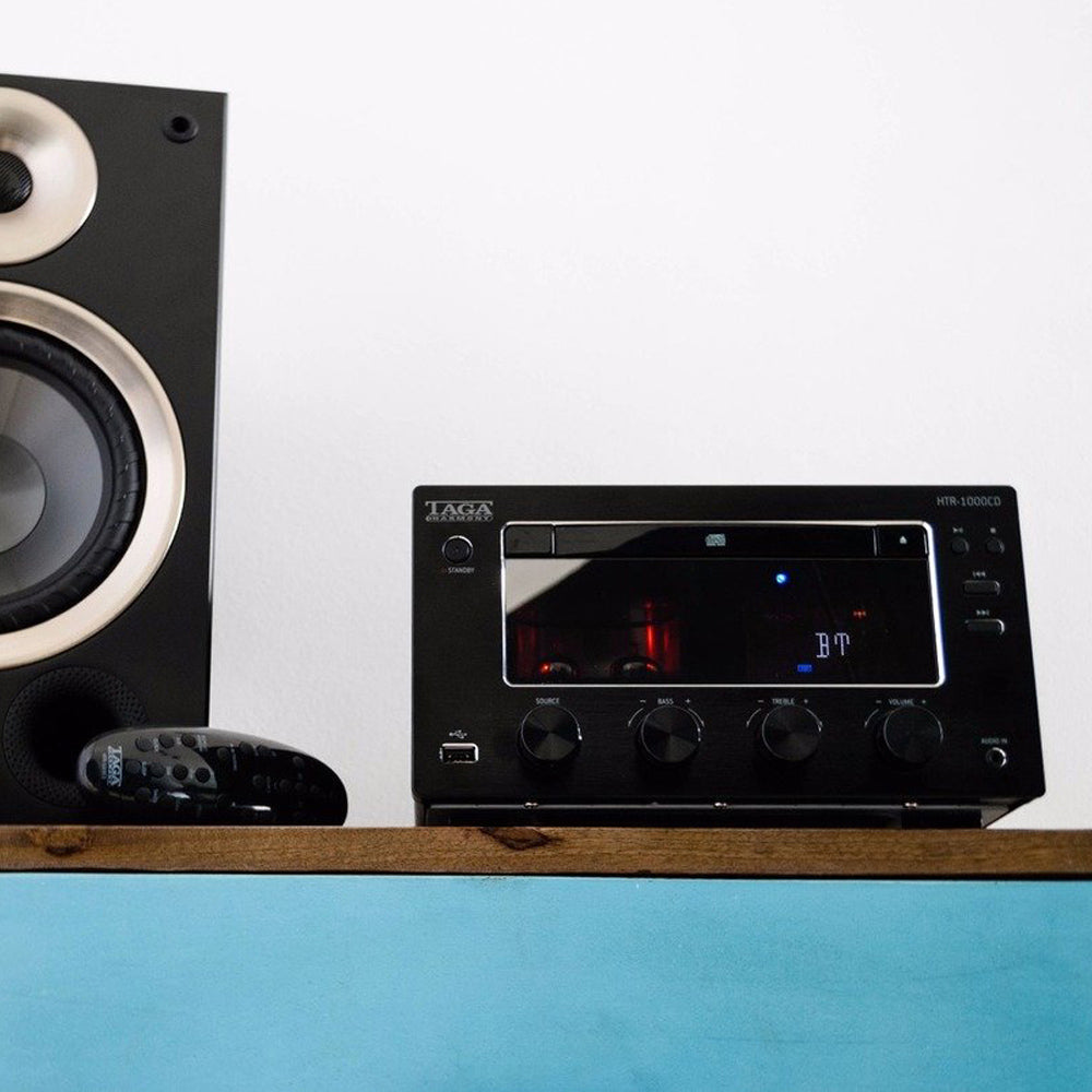 Taga Harmony CD Player and remote on bench