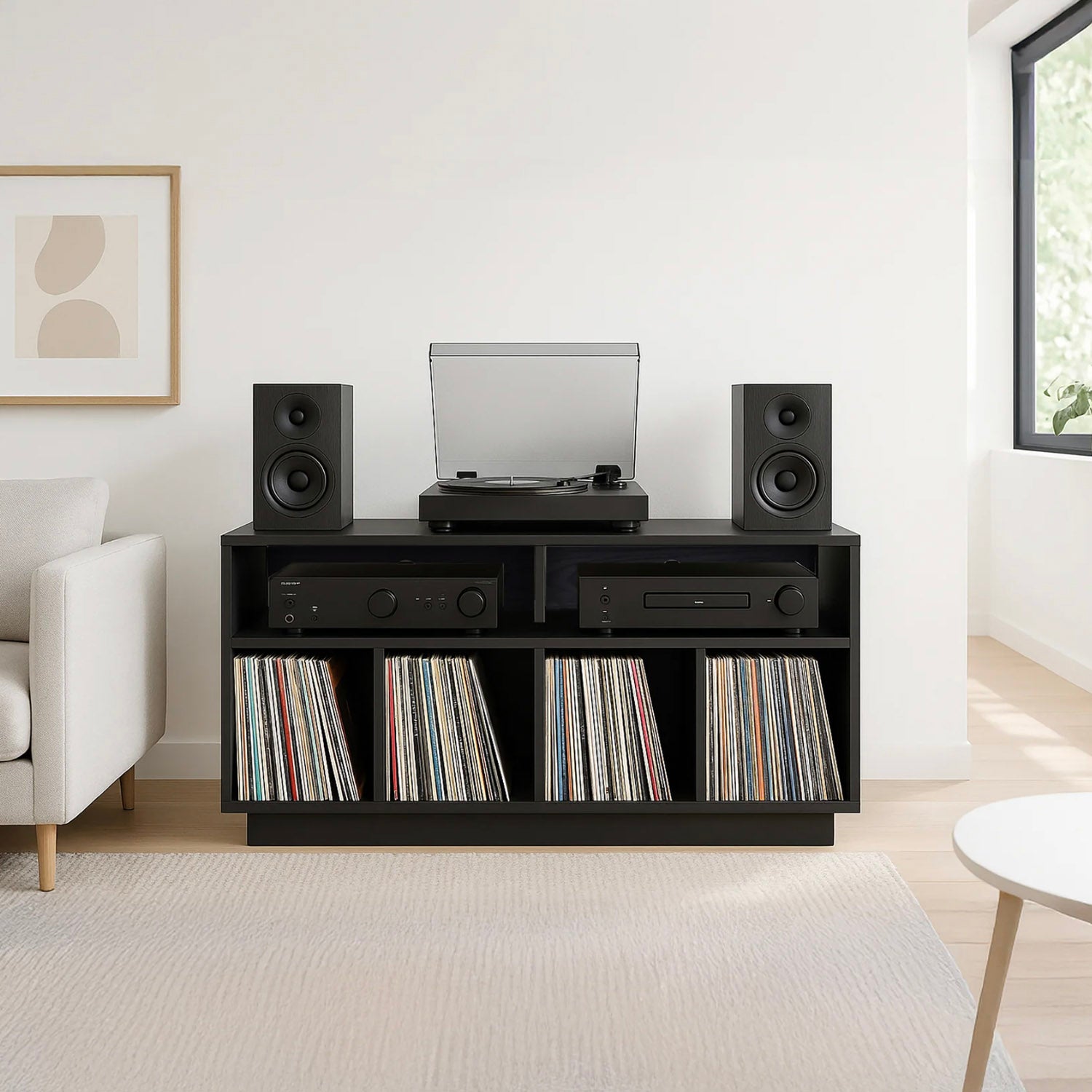 Black Tauris Edison 1200 Media Cabinet with speakers, record player, and vinyl records in a living room setting.