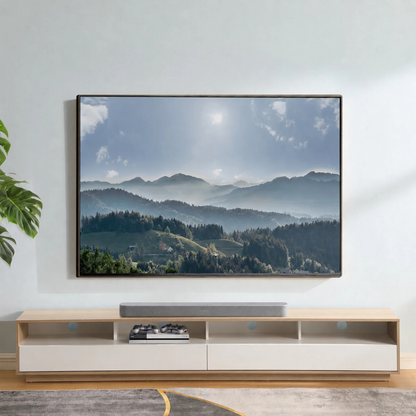 Modern living room with a large TV displaying a mountain scene, below a wooden entertainment console.
