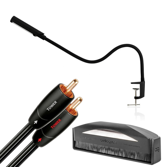 Light, cables and turntable brush on a white background