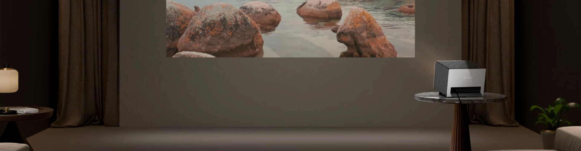 Valerion Projector displaying a nature scene on a wall in a room with a lamp and plant.