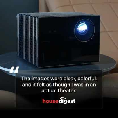 Black projector on a table with a quote and 'housedigest' logo