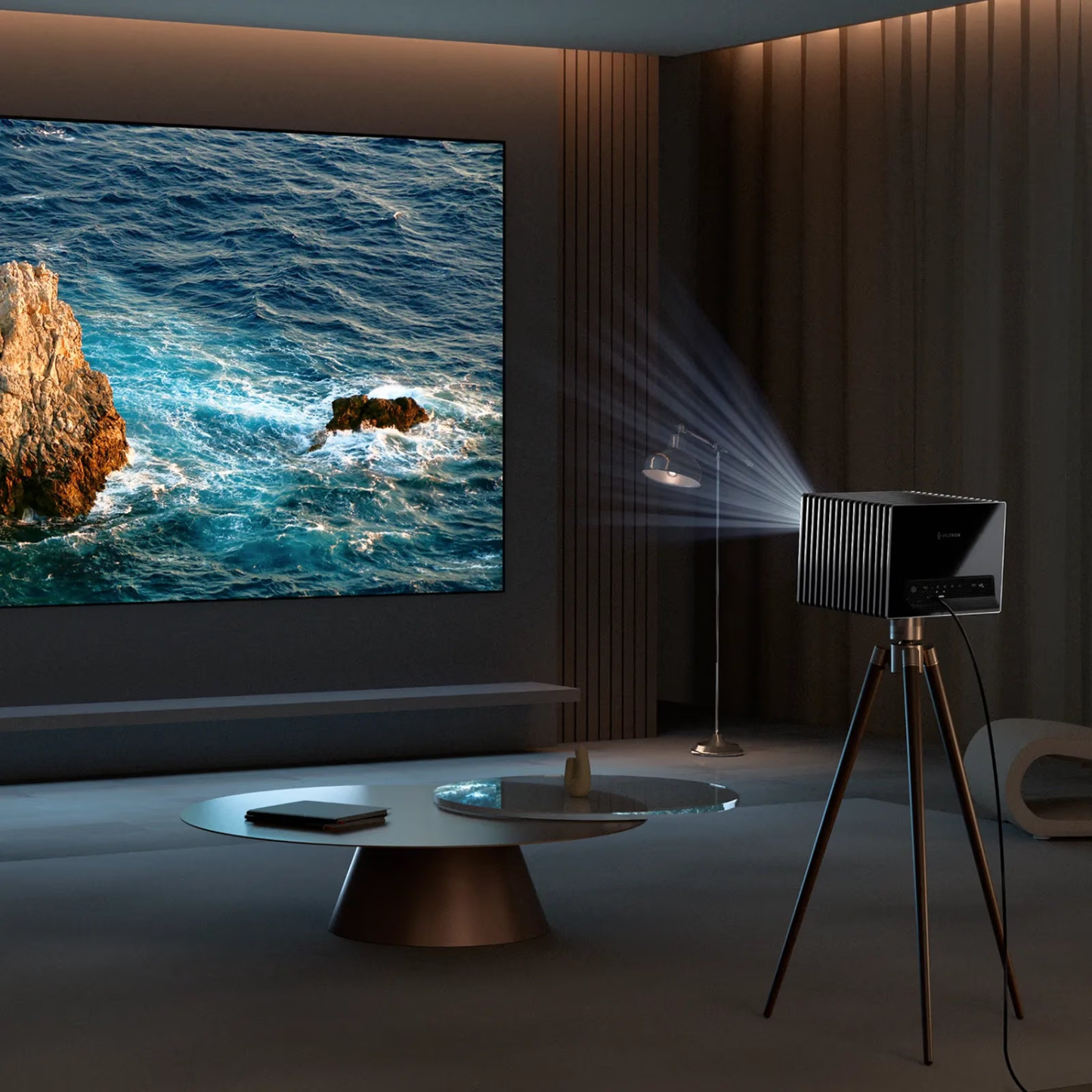 Projector displaying an ocean scene on a wall in a dark room with a tripod stand.