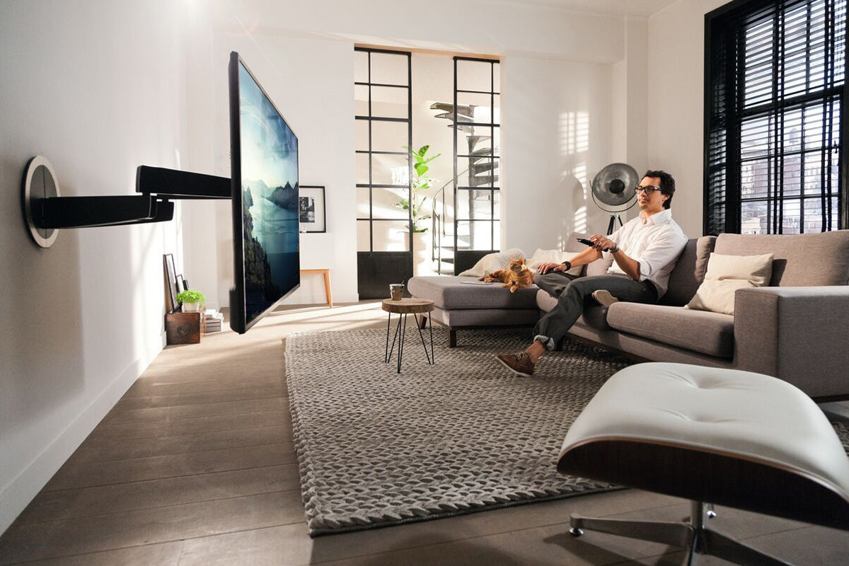 Vogels MotionMount NEXT 7355 Motorised TV Wall Mount - Shown in action in living room