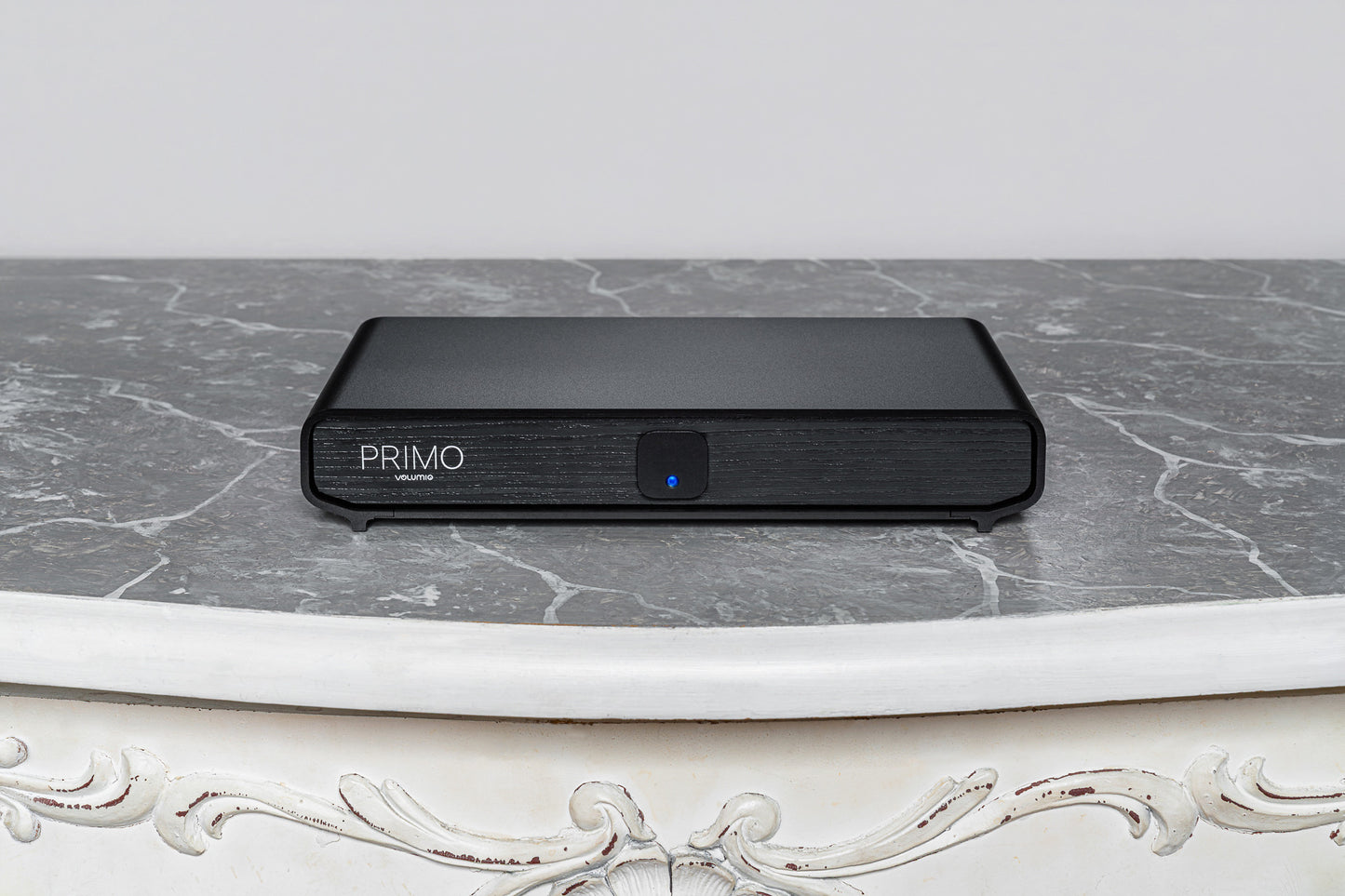 Volumio Primo V3 Streaming DAC sitting on a grey marble bench