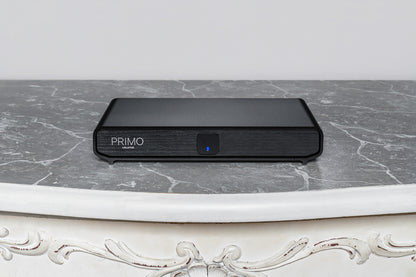 Volumio Primo V3 Streaming DAC sitting on a grey marble bench