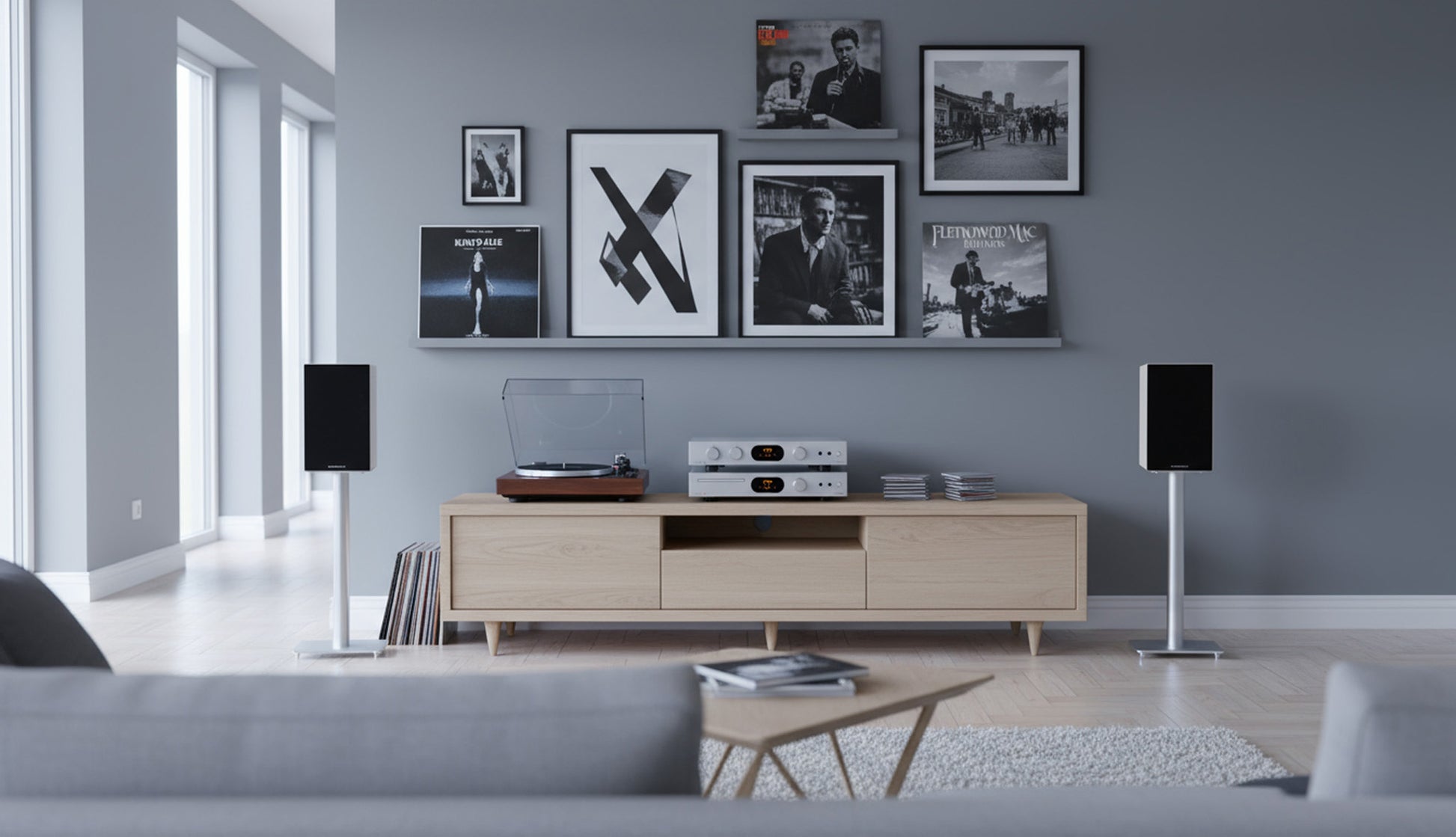 Modern living room with a gray wall, wooden entertainment console, and framed pictures.