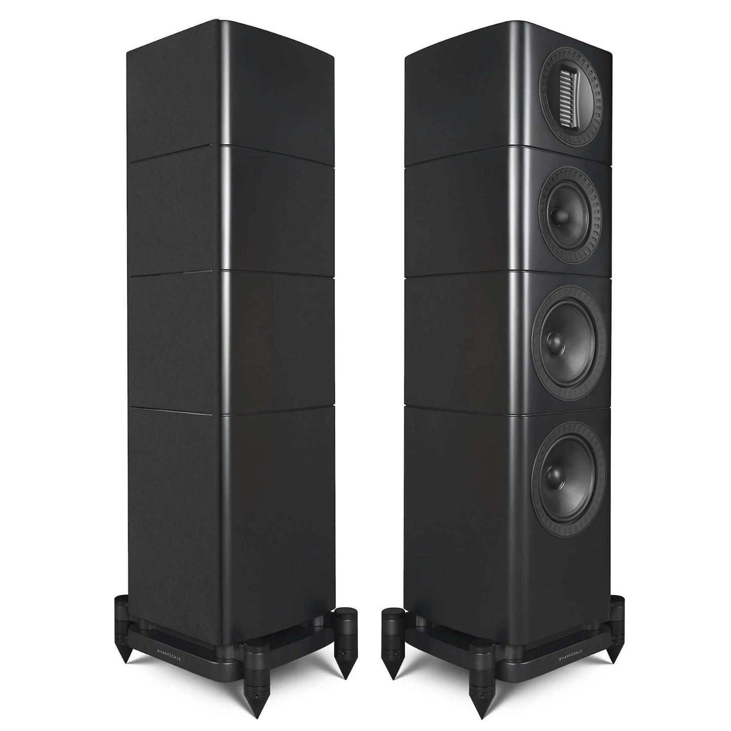A pair of black tower floorstanding speakers with four stacked driver sections and dual feet, shown against a plain white background.