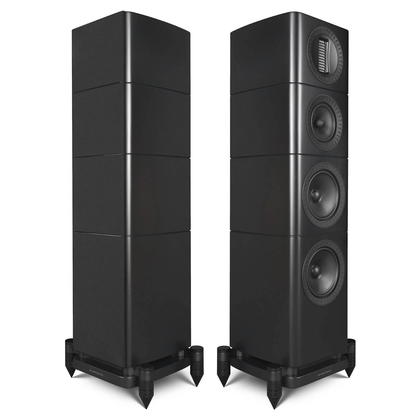 A pair of black tower floorstanding speakers with four stacked driver sections and dual feet, shown against a plain white background.
