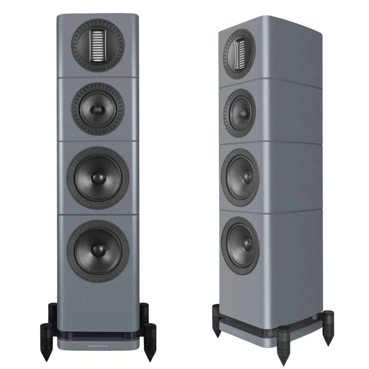 Two tall floorstanding speakers shown side by side on a plain white background. The speakers have a metallic gray finish with black and dark gray drivers and are mounted on black feet.
