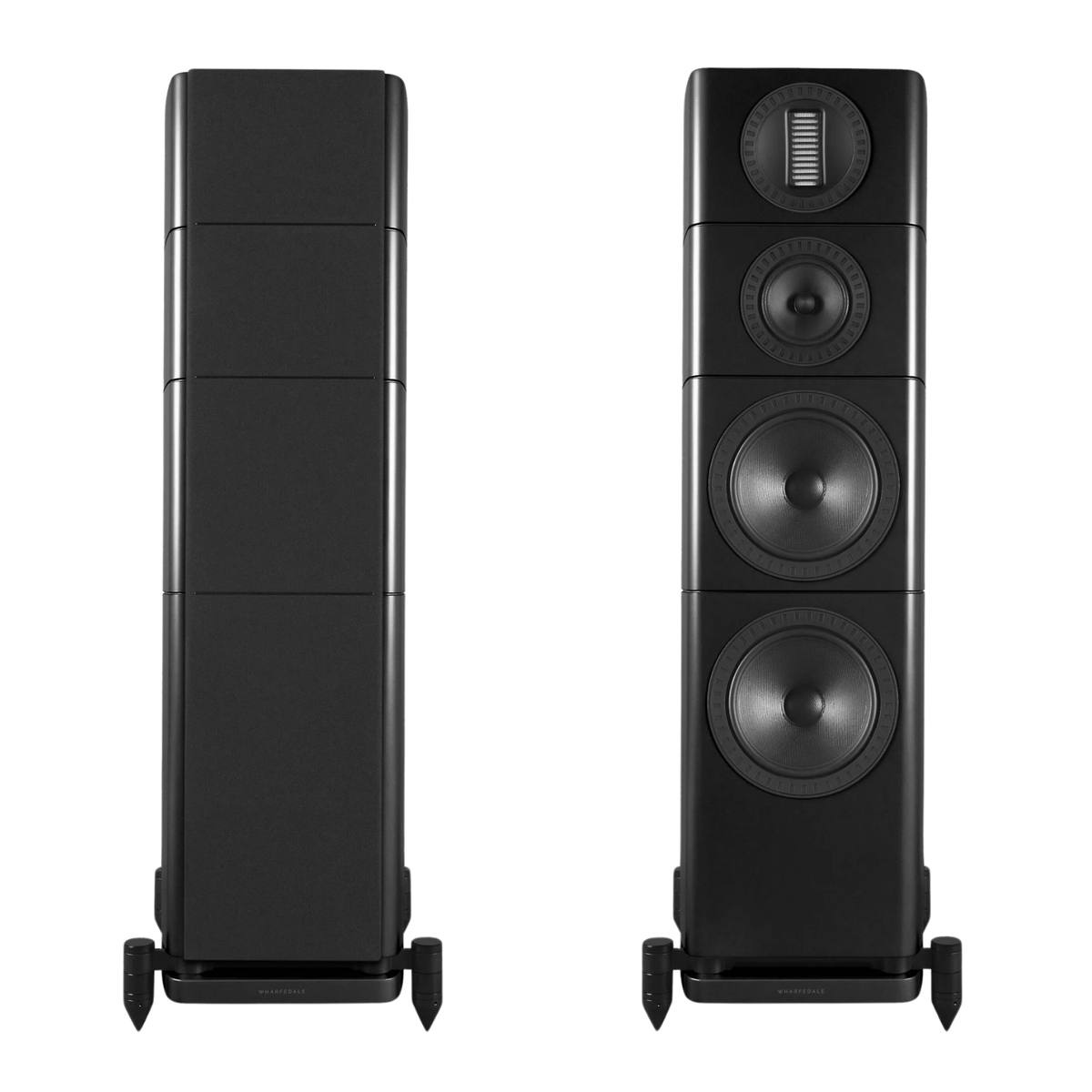 Two black floorstanding speakers shown side by side against a white background, with the left speaker displaying its rear panel and the right speaker displaying its front panel with three drivers and a tweeter.