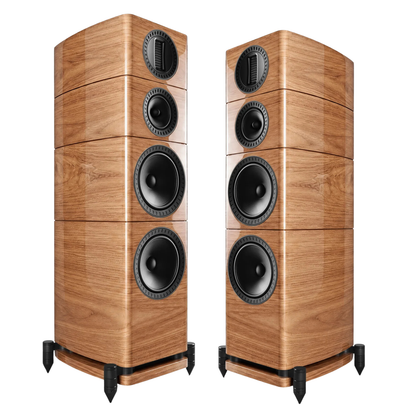Two tall floorstanding speakers with a glossy wood grain finish and black drivers, shown on a plain white background.