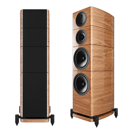 Two floorstanding speakers shown on a white background, one displaying the black front baffle and wood-grain side panels, and the other showing the wood-grain front with black drivers and grille.