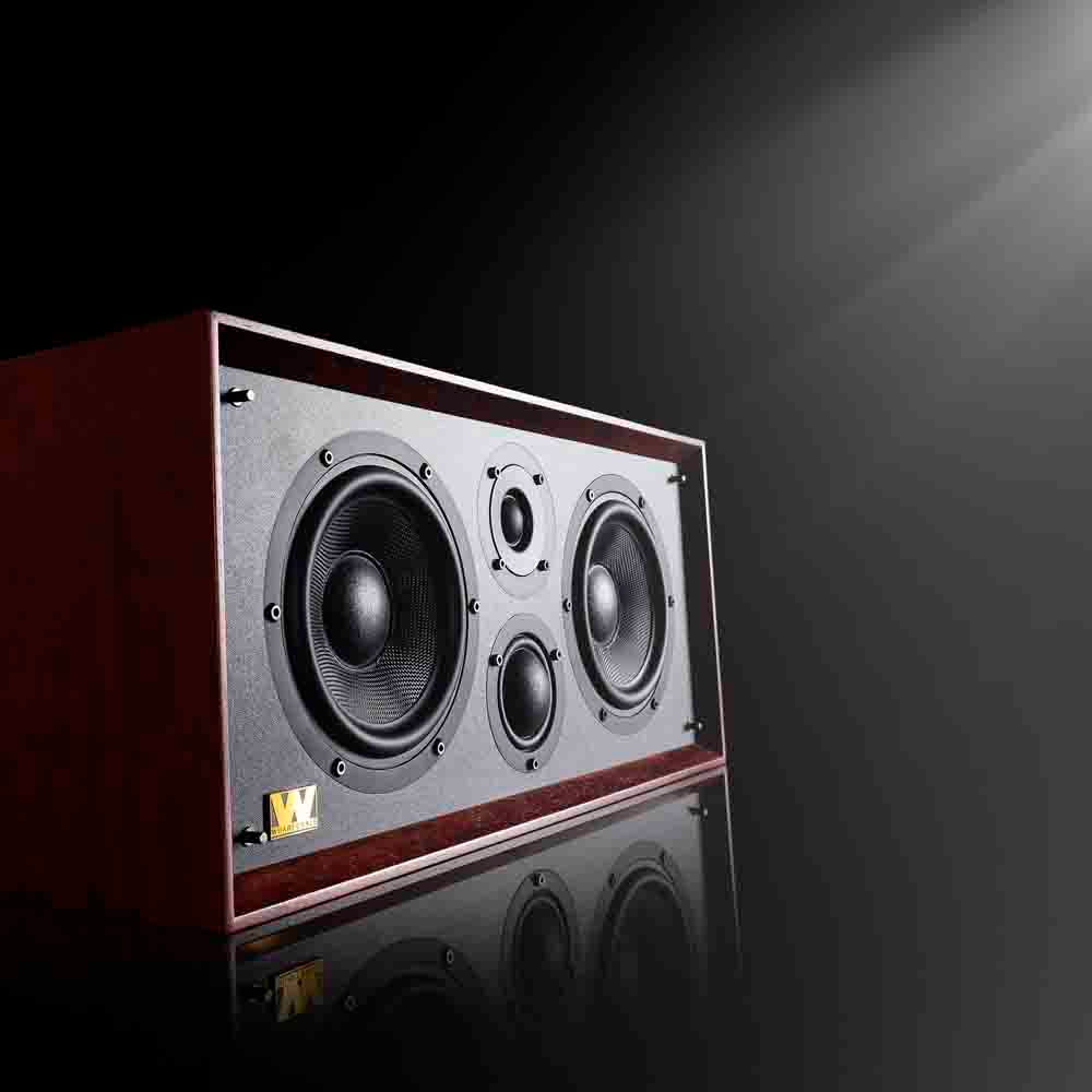Speaker system on a reflective surface with a dark background