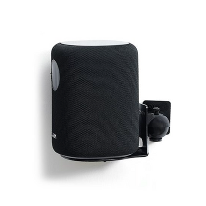 Black speaker mounted on a white wall