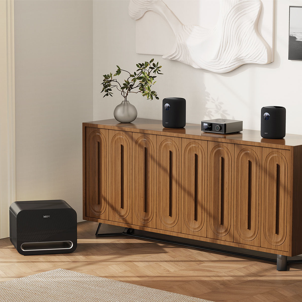 Wooden cabinet with WiiM Sound Smart Speakers in black, WiiM Subwoofer in a room setting
