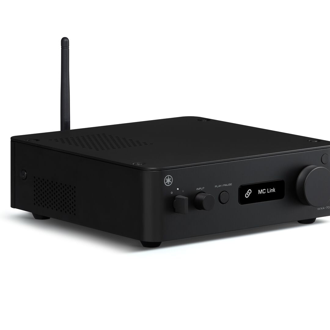 A black Yamaha wireless audio receiver with an external antenna, featuring control knobs and a small digital display on a clean white background.