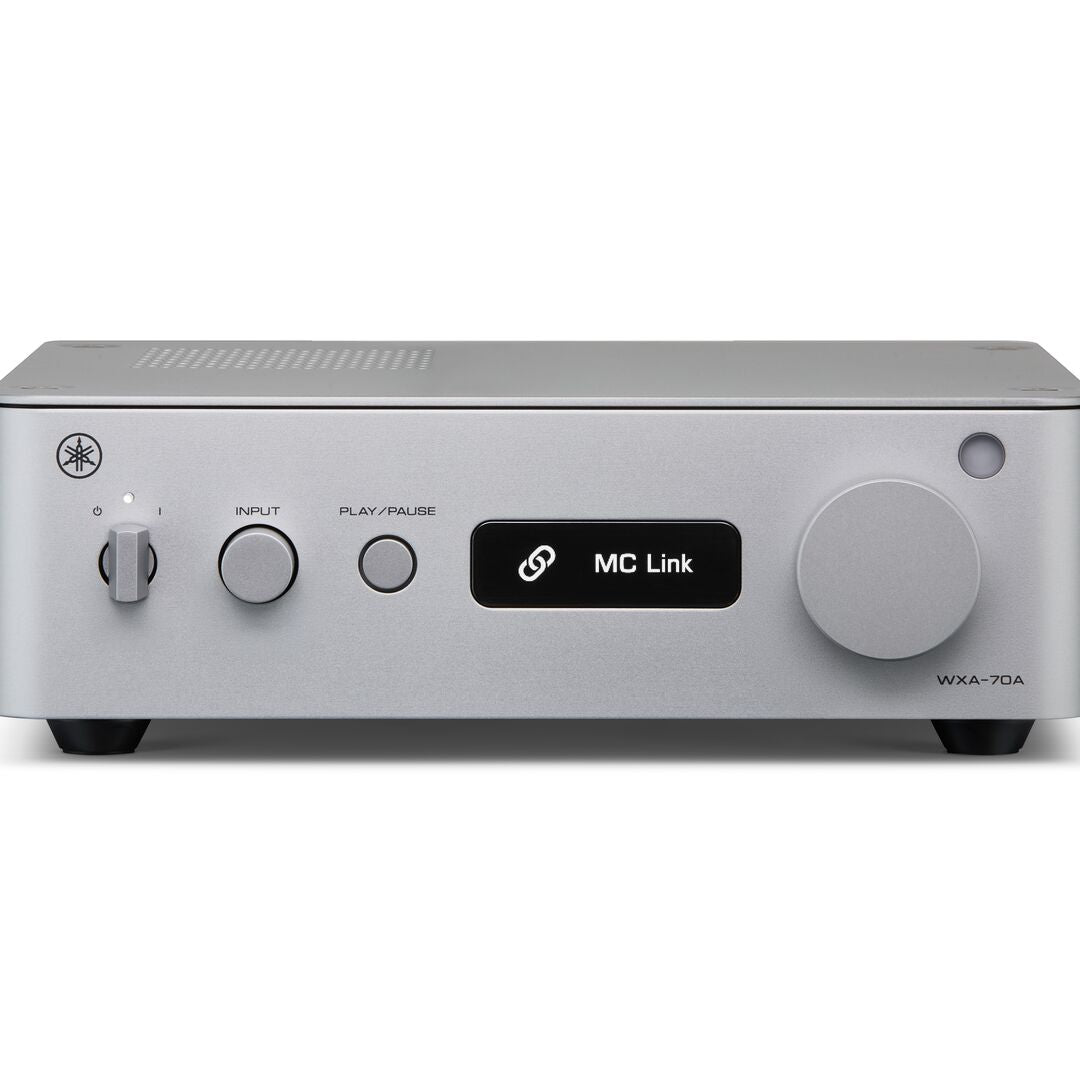 A silver Yamaha WXA-70A receiver or amplifier with a black central display screen showing 'MC Link' and a large round control knob on the right side, photographed against a plain white background.