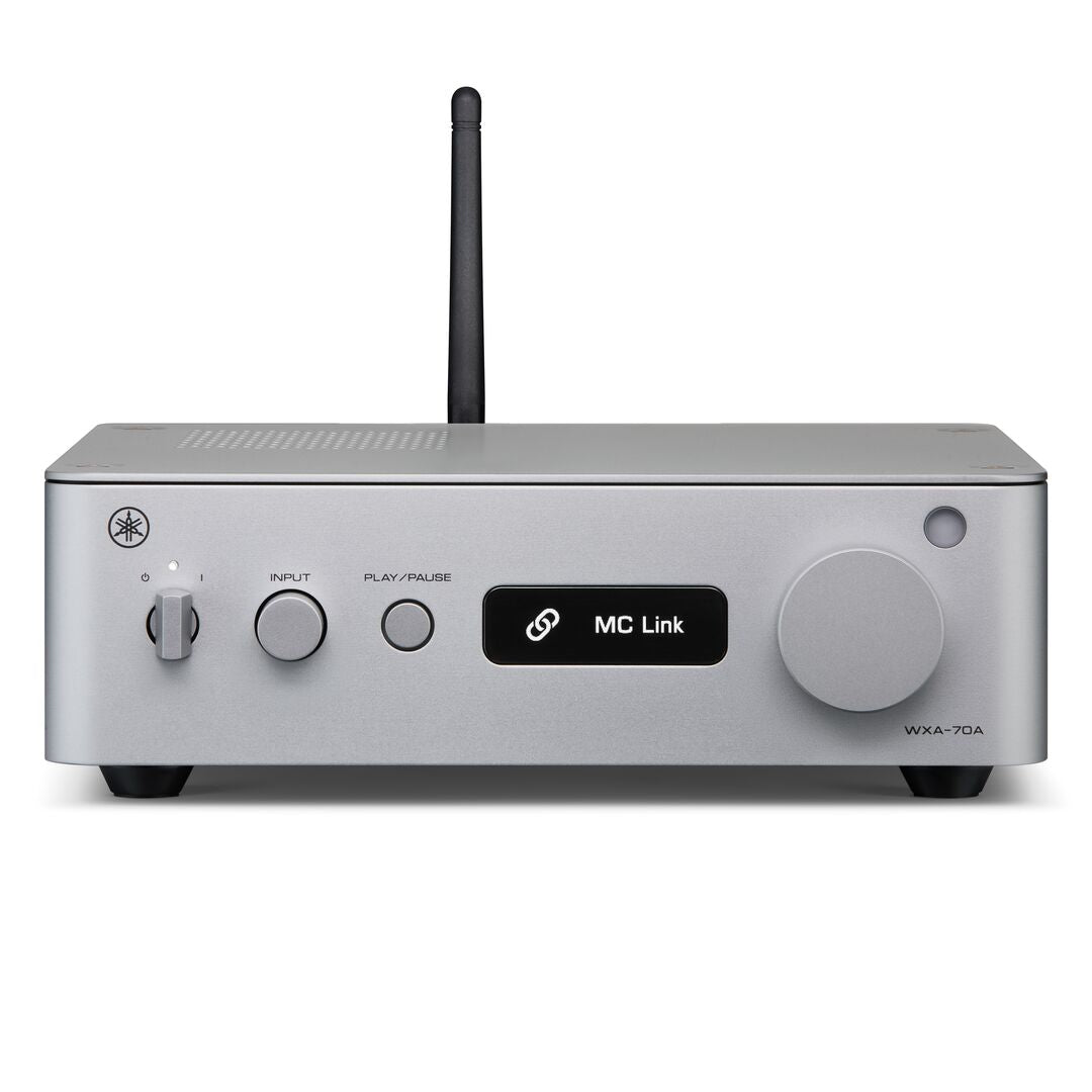 A silver Yamaha wireless receiver with a black antenna, featuring a digital display showing 'MC Link' and various control buttons on a clean white background.