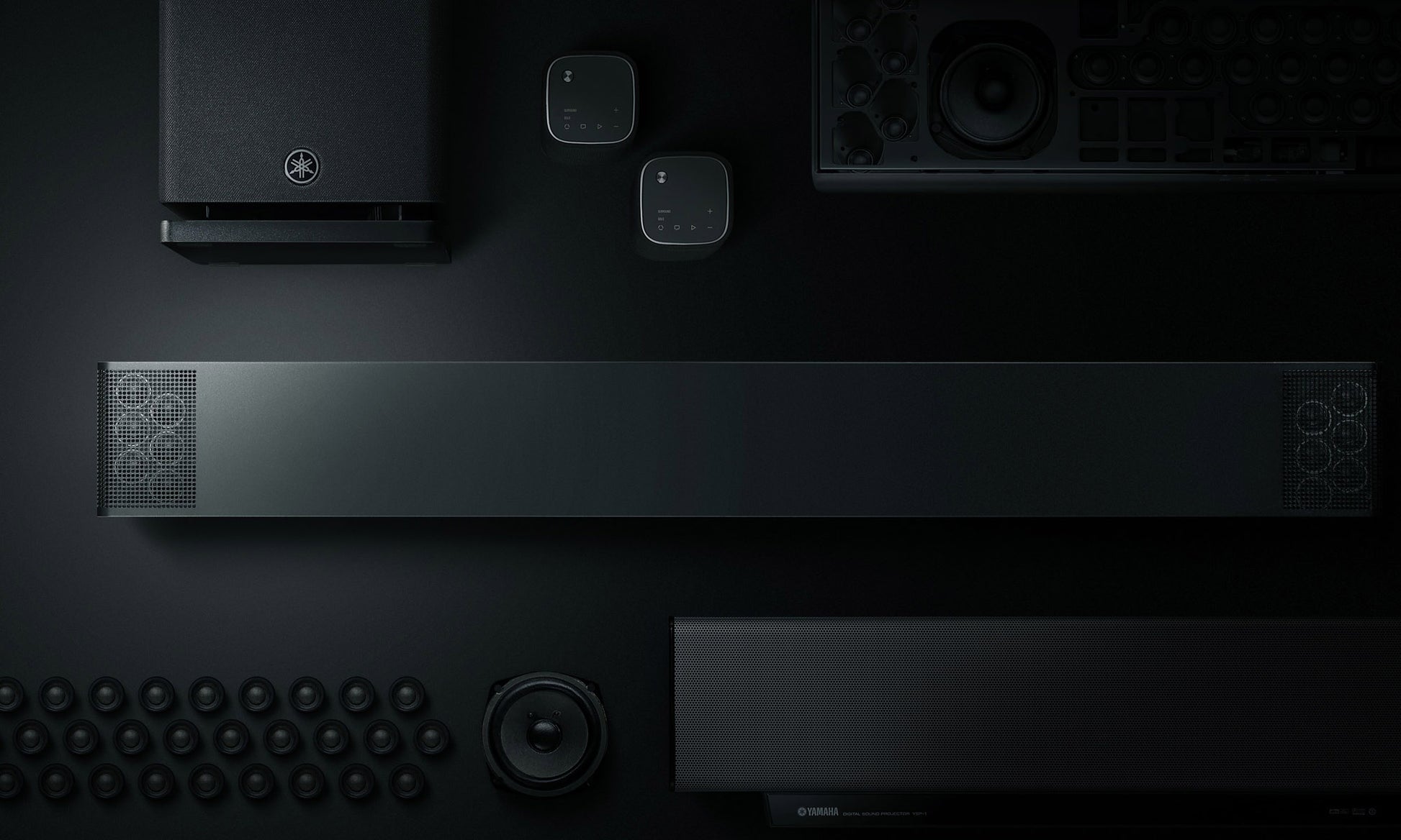 Black electronic devices arranged on a dark surface