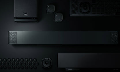 Black electronic devices arranged on a dark surface